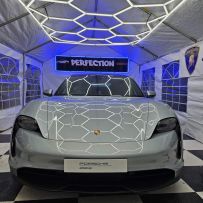 Hexagon SMG LED Lighting illuminating a garage space, showcasing its modular and eye-catching design
