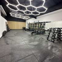 Hexagon SMG LED Lighting illuminating a garage space, showcasing its modular and eye-catching design