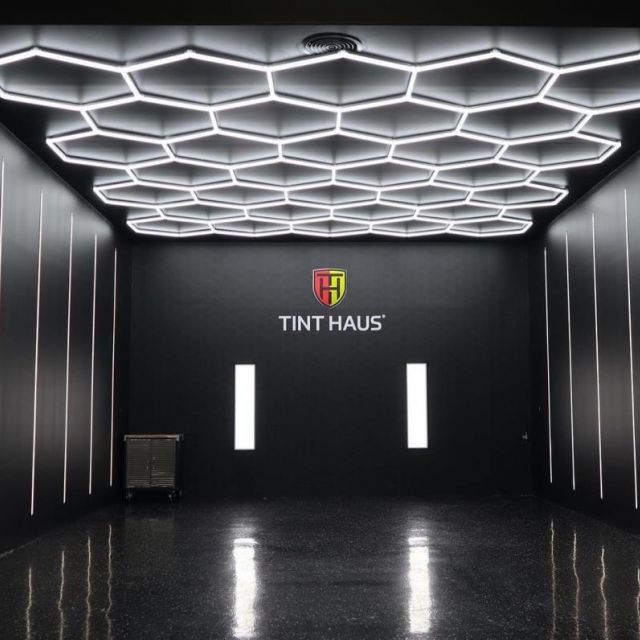 Hexagon SMG LED Lighting illuminating a garage space, showcasing its modular and eye-catching design